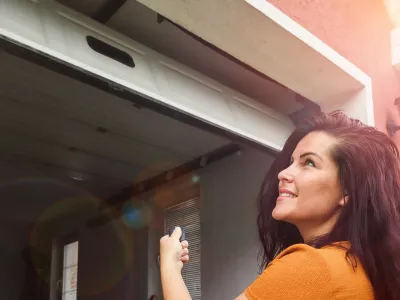 Happy customer with a garage door service professional